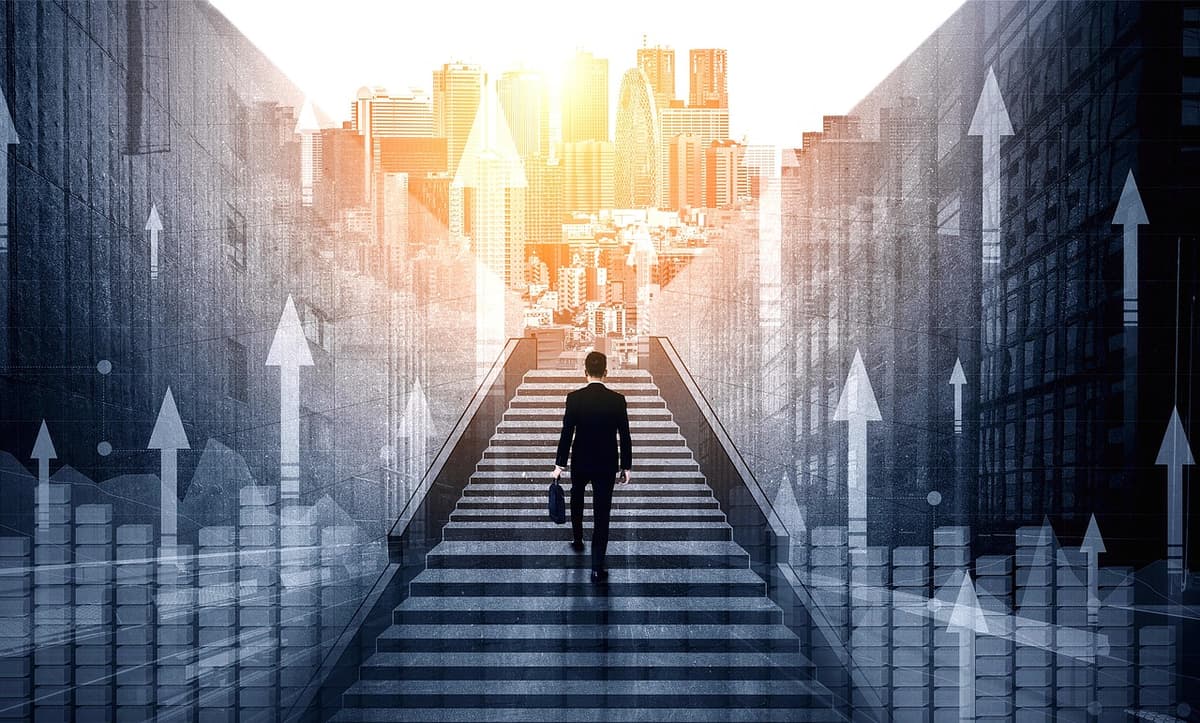 Businessman ascending stairs towards a city, symbolizing AI-driven business growth and innovation.